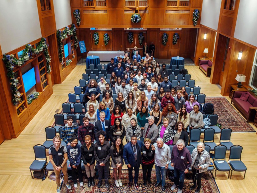 group photo of College of Liberal Arts students with Chaikens at Hintz Family Alumni Center