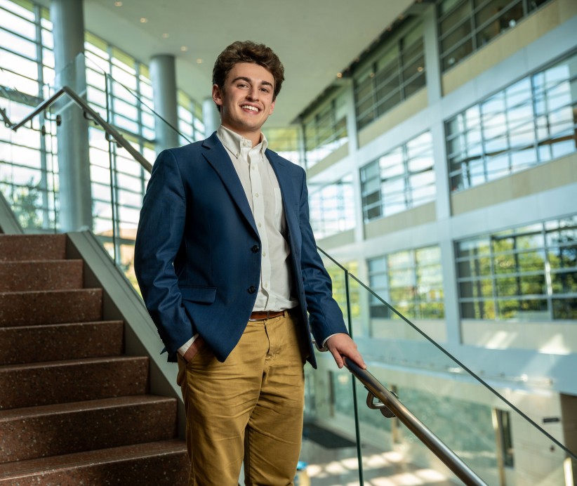 photo of Jaiden Asch standing on steps by Cardoni