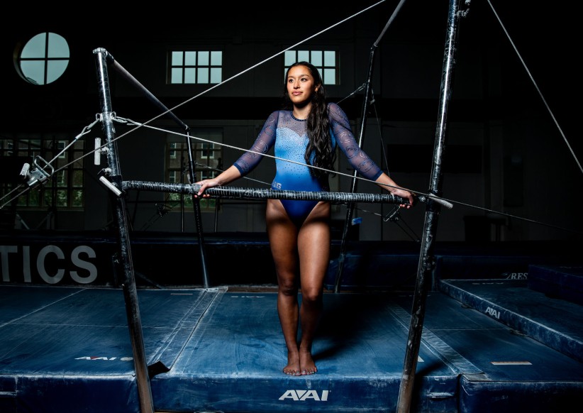 gymnast Ava Piedrahita posing with uneven bars by Cardoni