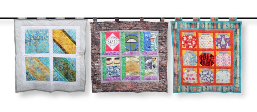 three quilts hanging side by side, courtesy