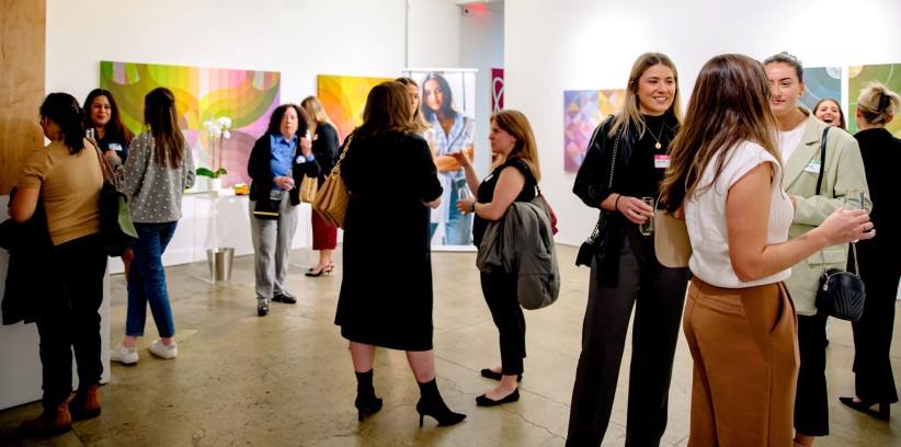 group of people at an alumni event in an art gallery by NYC/Tri State Area Alumni Group