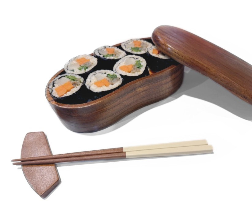 photo of a wooden lunch box with sushi and chopsticks, courtesy
