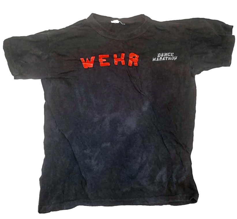 photo of black WEHR Dance Marathon t-shirt from 1973/74, courtesy