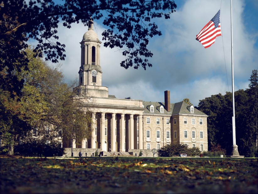 photo of Old Main on a partly cloudy summer day by Michael Owen/Penn State