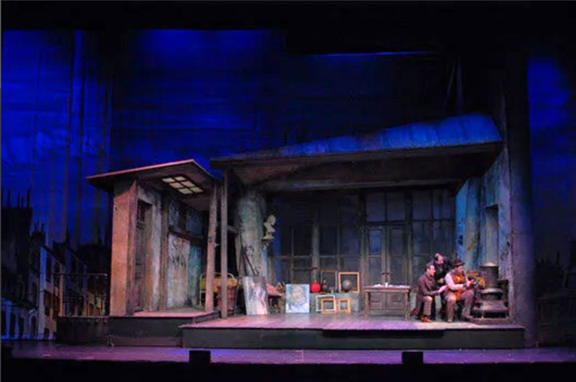 photo of a stage during a performance, courtesy
