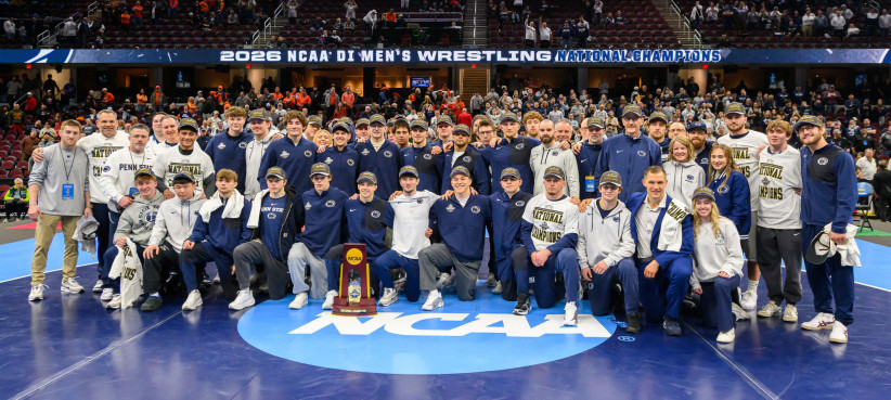 photo of wrestling team with trophy by Mark Selders/Penn State Athletics