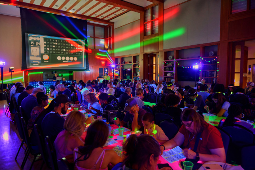 photo of We Are Weekend 2026 attendees playing glow-in-the-dark bingo in Robb Hall at Hintz, by Steve Tressler