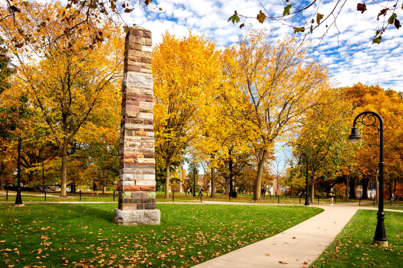 photo of the obelisk at University Park amid fall leaves, by Nick Sloff '92 A&A