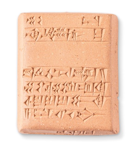 Closeup photo of clay tablet bearing cuneiform marks created by pressing wedges into wet clay, then baking the tablets, by Nick Sloff '92 A&A.