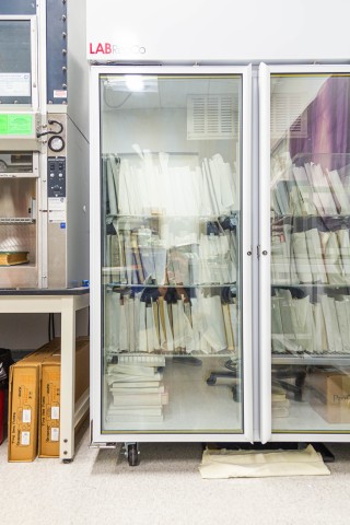 Photo of books in a special vacuum freeze-drying chamber to ward off mold damage and warping after experiencing water damage, by Nick Sloff '92 A&A.