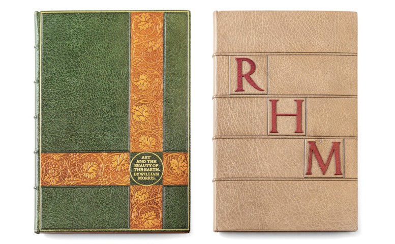 Two books bound in leather, one green with a gold criss cross and one tan with red leather onlays reading RHM. Photo by Nick Sloff '92 A&A.