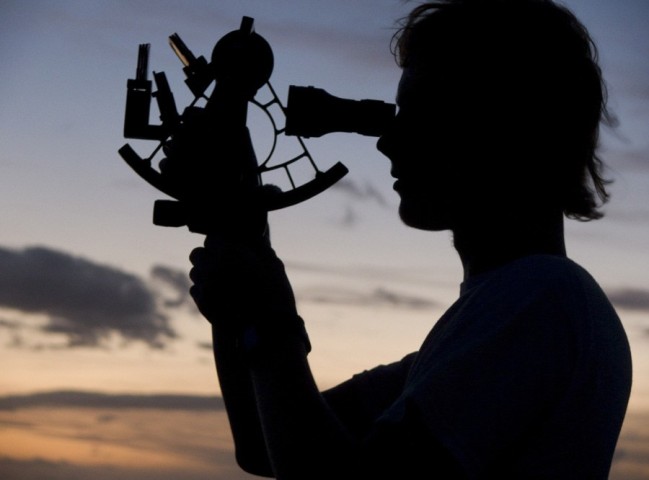 silhouette of a person playing a sextant, photo by Zena Cardman