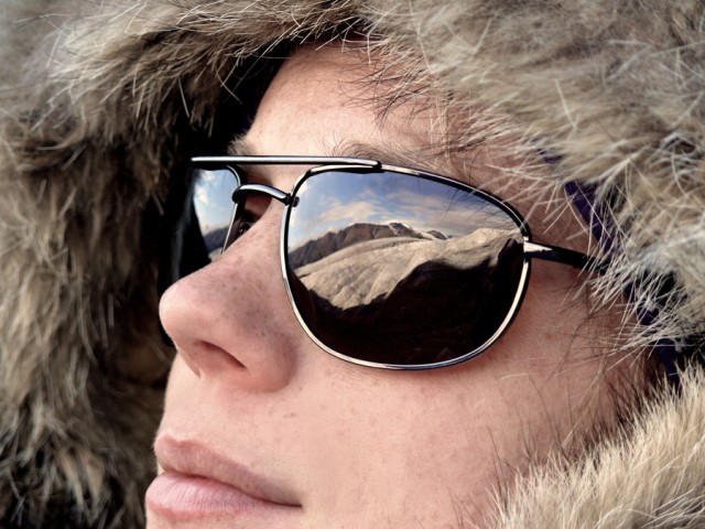 closeup of Zena wearing sunglasses with a fur-lined hooded coat, photo by Zena Cardman