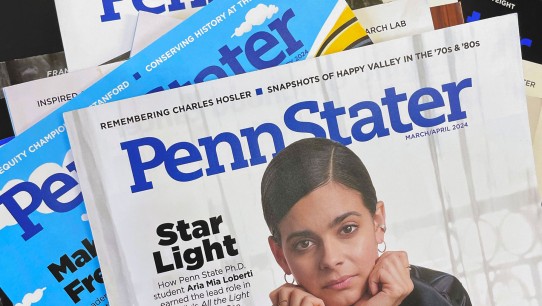 a stack of Penn Stater Magazine issues