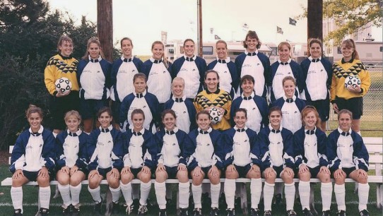 1994 women's soccer team during their first season, seated under Jeffrey Field sign, by Penn State All-Sports Museum