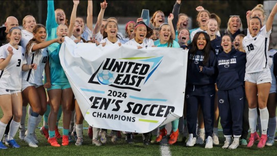 photo of Penn State Harrisburg soccer team holding up a banner, photo by Penn State Harrisburg