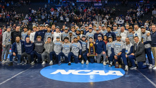 group shot of Penn State wrestling team after setting another NCAA championship record, by Mark Selders/Penn State Athletics