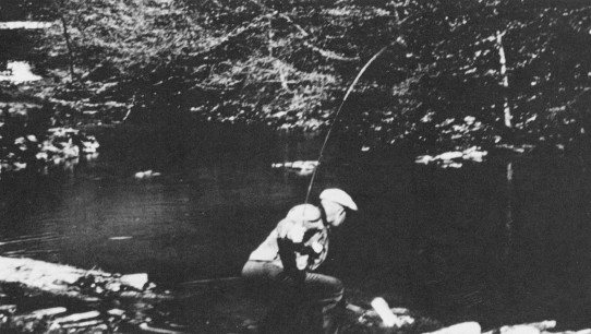 black and white photo of Eisenhower fishing