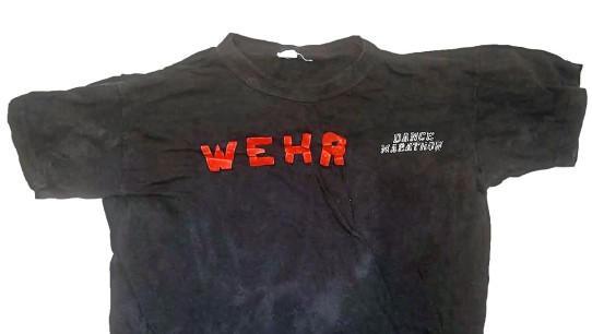 photo of black WEHR Dance Marathon t-shirt from 1973/74, courtesy