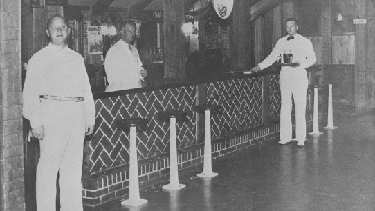 1934 photo of Rathskeller owner C.C. Doggie Alexander and bartenders, Penn Stater Magazine