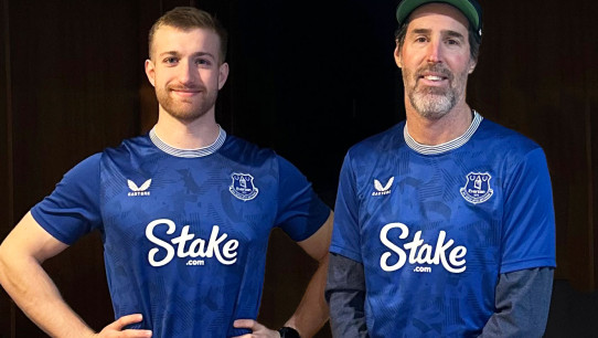 two men wearing blue Stake jerseys, courtesy