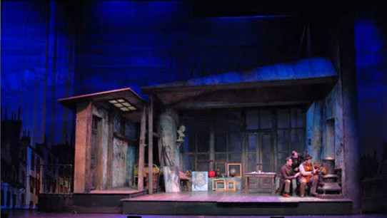 photo of a stage during a performance, courtesy
