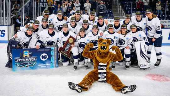 women's hockey team with the Nittany Lion and their trophy, photo by Mark Selders/Penn State Athletics
