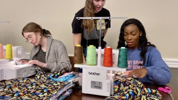 Days for Girls club members sewing reusable menstrual products, courtesy