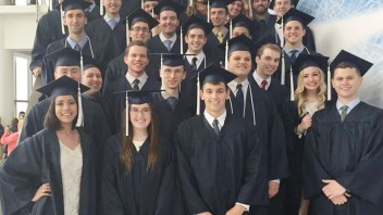 commencement photo of students in caps and gowns, by Penn State