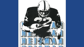 cover of January 1974 cover of Penn Stater Magazine featuring illustration of John Cappelletti carrying football with the words Heisman in blue, by Penn Stater Archives