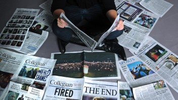 photo of Brittany Horn sitting on the floor amid dozens of copies of the Daily Collegian, by Jeff Ruppenthal/Lancaster Newspapers