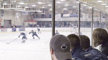 photo of the back of ice hockey fans' heads watching a hockey game by Nick Sloff '92 A&A