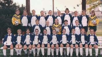 1994 women's soccer team during their first season, seated under Jeffrey Field sign, by Penn State All-Sports Museum