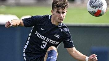 Matthew Henderson kicking soccer ball, photo by Penn State Athletics