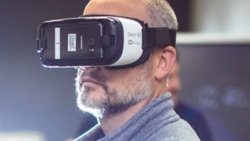 photo of a man wearing a virtual reality headset covering his eyes, photo by Center for Immersive Experiences