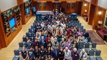 group photo of College of Liberal Arts students with Chaikens at Hintz Family Alumni Center