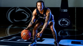 photo of Ace Baldwin dribbling basketball by Cardoni