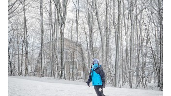 photo of snowboarder in blue jacket