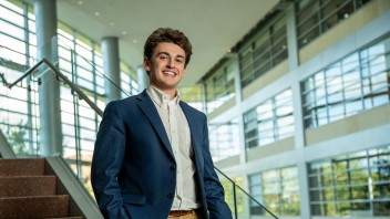 photo of Jaiden Asch standing on steps by Cardoni