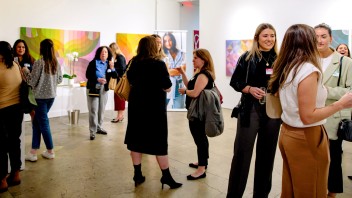 group of people at an alumni event in an art gallery by NYC/Tri State Area Alumni Group