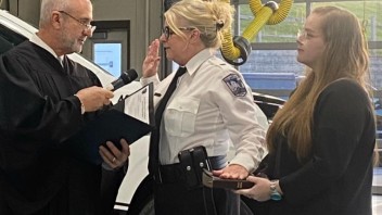 Doyle being sworn in as an officer, courtesy