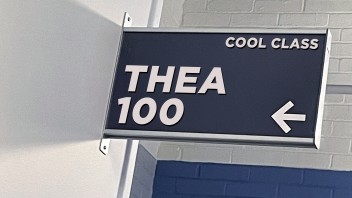 classroom sign that reads THEA 100
