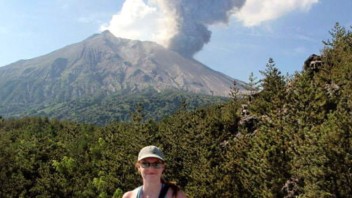 Wauthier in foreground of an active volcano, courtesy
