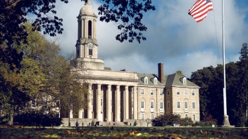 photo of Old Main on a partly cloudy summer day by Michael Owen/Penn State