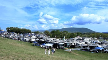 wide shot of tailgaters against backdrop of Mount Nittany by Penn State Alumni Association