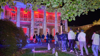 photo of University House lit up with Halloween lights as part of Haunted Valley 2025, photo by Penn State Alumni Association
