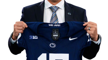 Matt Campbell holding up a Penn State jersey, photo by Mark Selders/Penn State Athletics