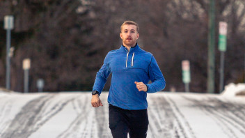 Hollingham running on a snowy road by Nick Sloff '92 A&A