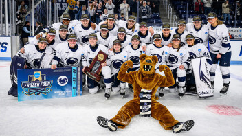 women's hockey team with the Nittany Lion and their trophy, photo by Mark Selders/Penn State Athletics