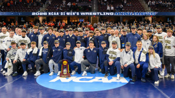photo of wrestling team with trophy by Mark Selders/Penn State Athletics